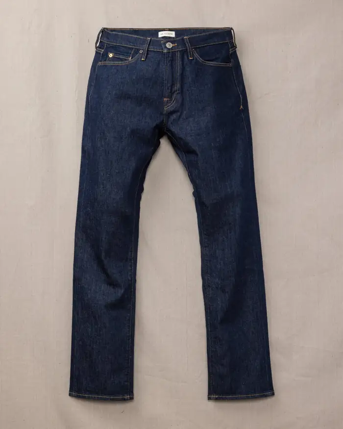 Dark raw denim jeans, flat lay