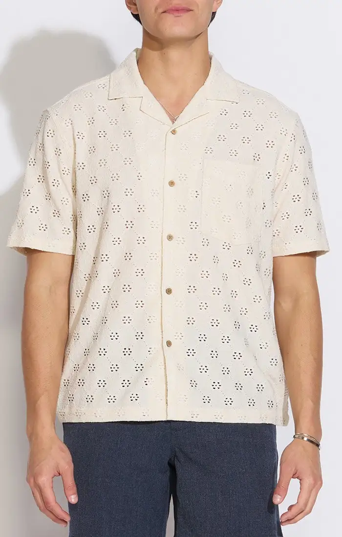 Model wearing a cream textured camp shirt